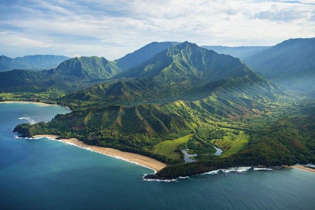 Rugged green coastline and beach in Hawaii