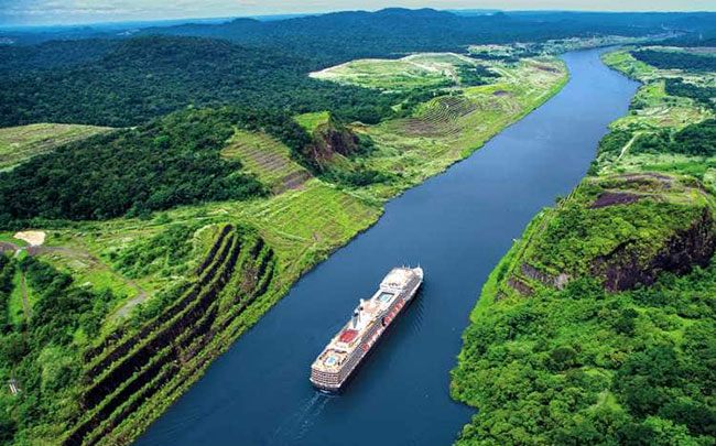 Cruise ship sailing through the rainforest on the Panama Canal