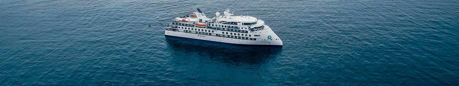 Expedition cruise ship in calm polar water