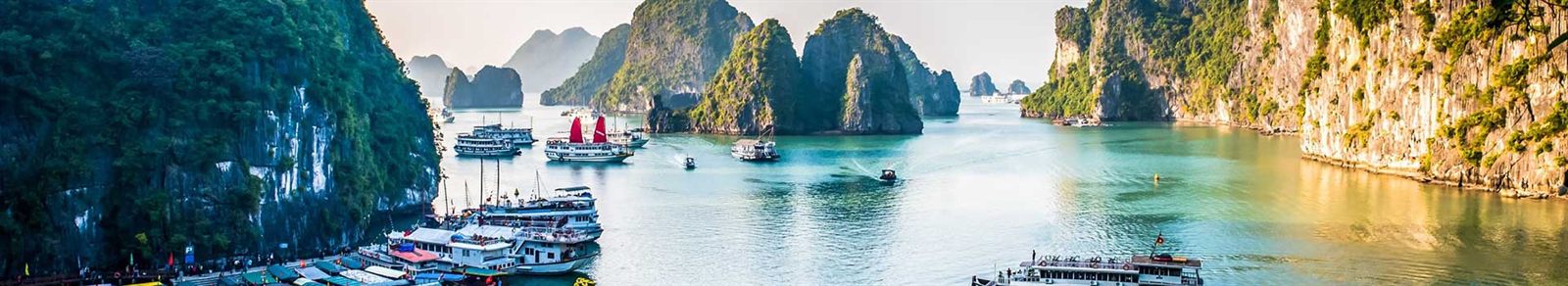 Traditional junks among the karst islands of Ha Long Bay, Vietnam