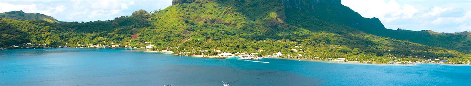 Green South Pacific island ringed by a turquoise lagoon